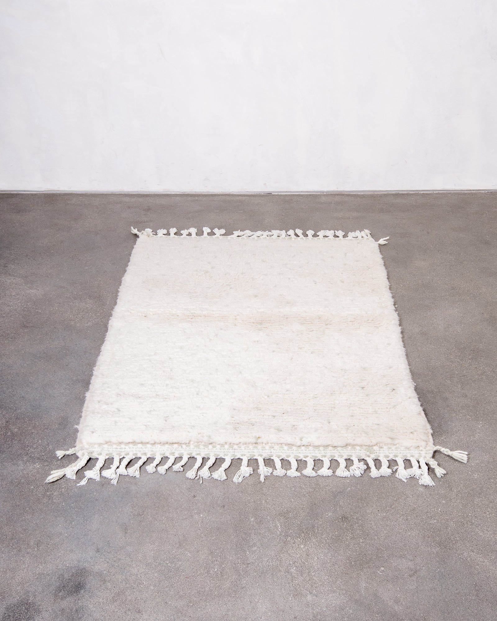 Modern, designer, handcrafted Berber rug from Morocco. Beniourain carpet with beautiful colours and patterns and fluffy wool texture.
